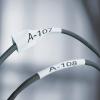 imageDYMO Rhino Industrial HeatShrink Labels 34quot Tube Black Print on WhiteBlack on White