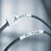imageDYMO Rhino Industrial HeatShrink Labels 34quot Tube Black Print on WhiteBlack on Yellow